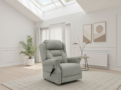 Beige recliner chair in a bright living room with plants and a skylight.