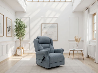 Blue recliner chair in a bright living room with white walls and large windows.