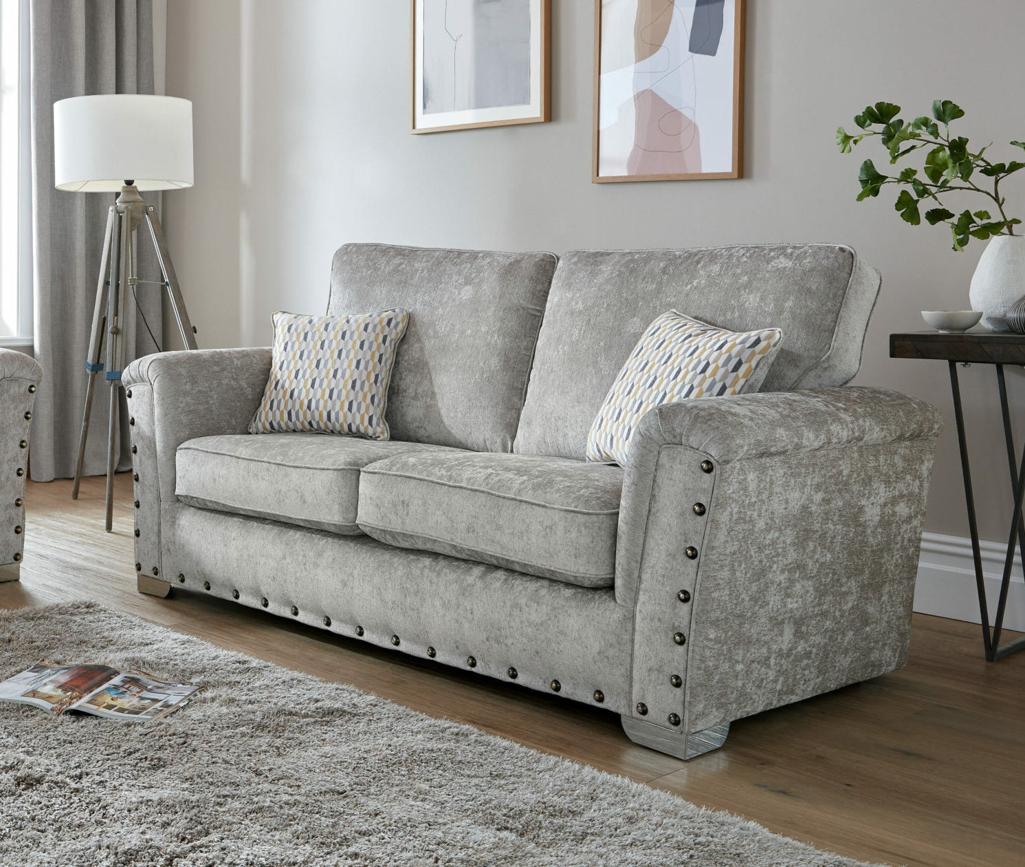 Nebraska Bespoke Grey Fabric Studded With Chrome Feet Sofa