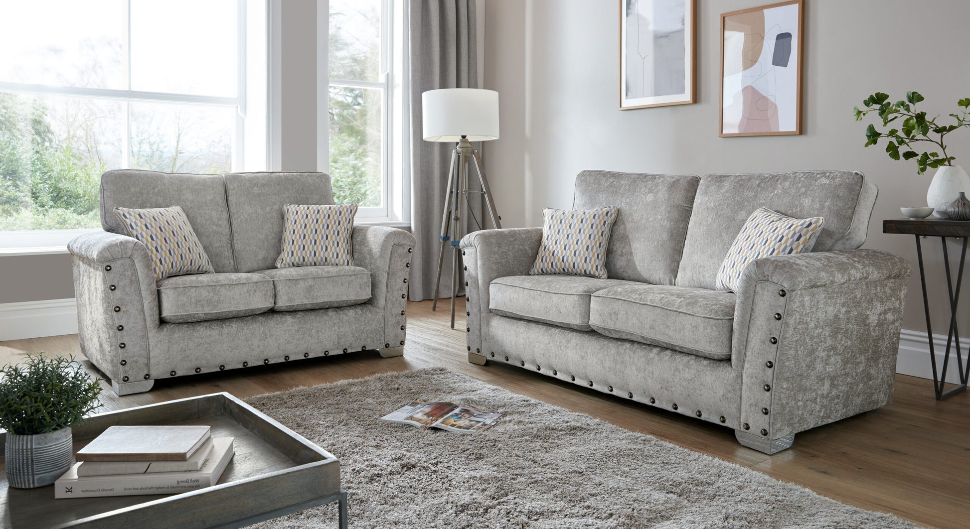 Nebraska Bespoke Grey Fabric Studded With Chrome Feet Sofa